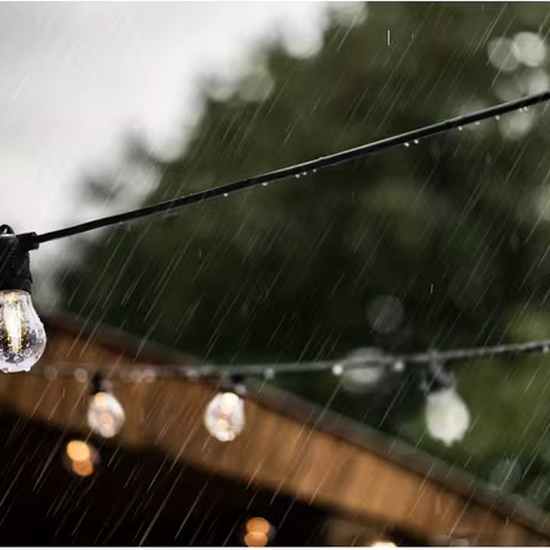 IP65 weatherproof festoon lights lit up outdoors in the rain